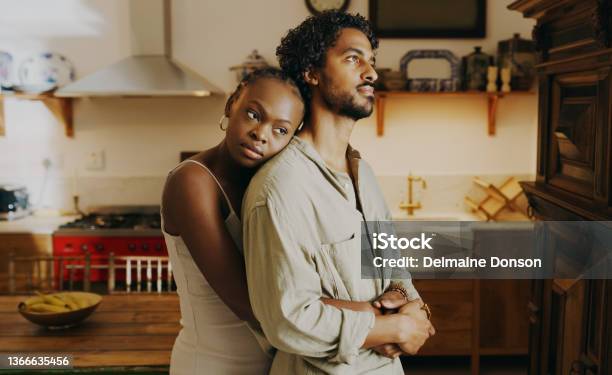 Shot Of An Attractive Young Woman Hugging Her Boyfriend While Bonding With Him At Home Stock Photo - Download Image Now