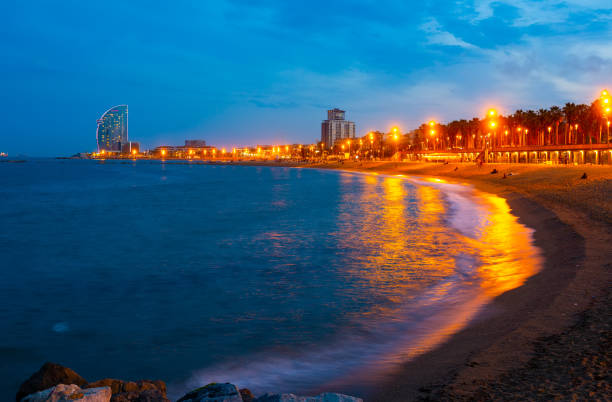 istock Illuminated Barceloneta beach on Mediterranean coastline on summer night 1366636606