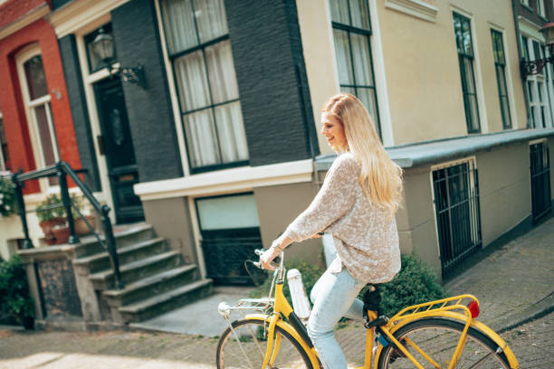 istock woman cycling in amsterdam 1366637513