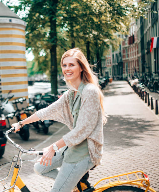 istock woman cycling in amsterdam 1366637600