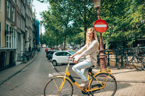 istock woman cycling in amsterdam 1366637638