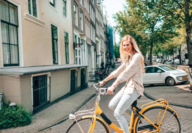 istock woman cycling in amsterdam 1366637665