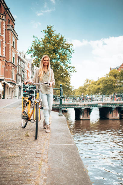 istock woman cycling in amsterdam 1366637710