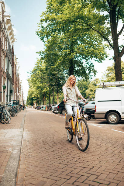 istock woman cycling in amsterdam 1366637739
