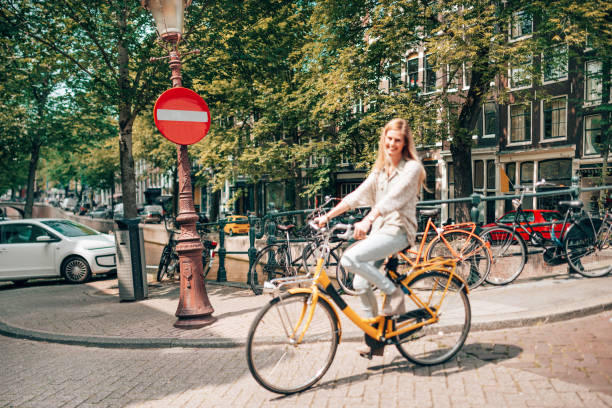 istock woman cycling in amsterdam 1366637880