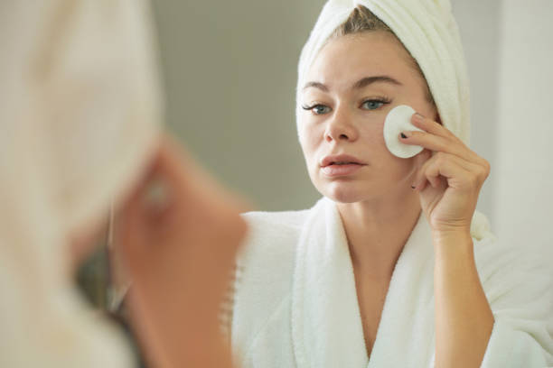 istock Woman Applying Moisturizing Face Toner 1366641565