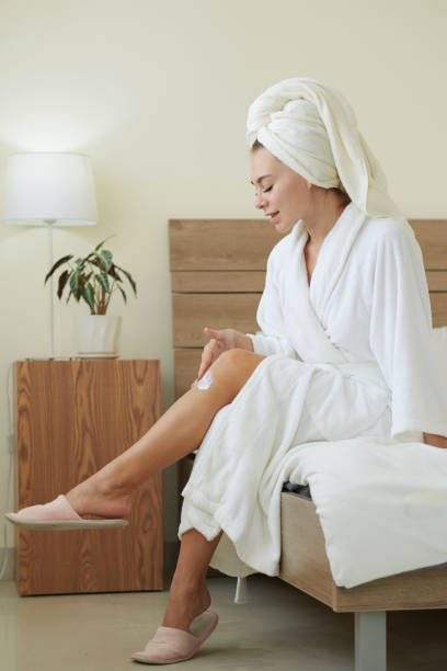 istock Woman Applying Tightening Cream 1366641596