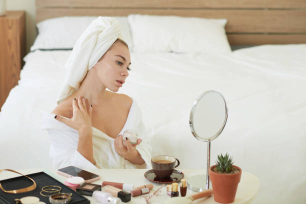 istock Woman Applying Firming Cream 1366641612