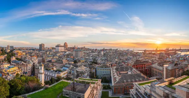 Genoa, Liguria, Italy downtown city skyline panorama from above at dusk.