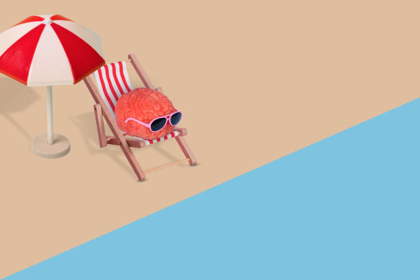 istock Creative funny composition made of human brain with sunglasses, relaxing on the beach. 1366641804