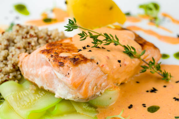 istock Salmon steak on the grill on white plate macro close up 1366642992