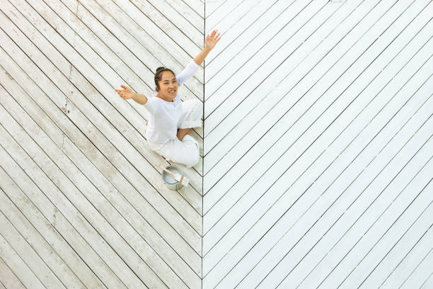 istock Above view smiling asian woman painting deck 1366646711