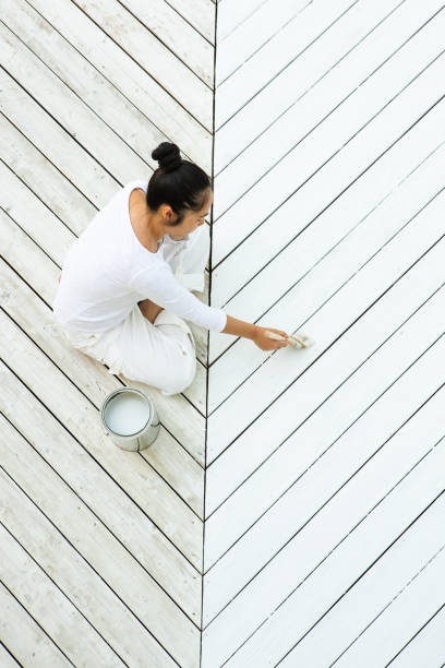 istock Above view ssian woman painting deck 1366647034