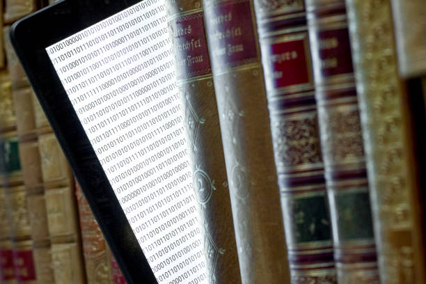 istock old books on the shelf with a tablet in between 1366647136