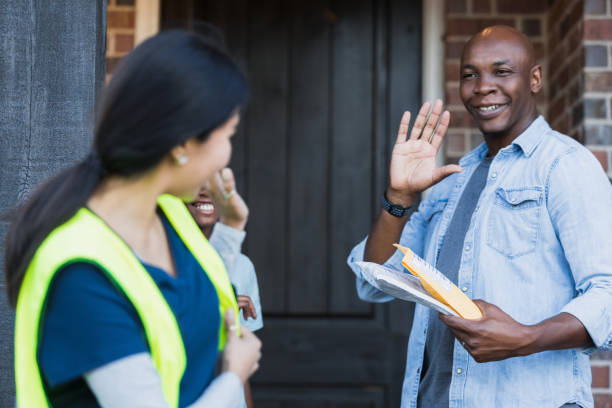 istock After dropping off packages, delivery person waves at couple 1366649785