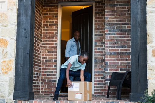 Man watches daughter pick up surprise package