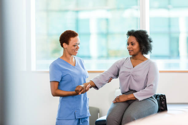 istock Physical therapist works with female patient 1366650096