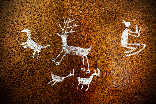 Close-up shot of a prehistoric drawing on a cave wall.