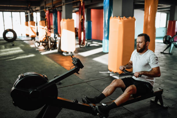 istock Rowing Workout For Male Athlete In Gym 1366654271