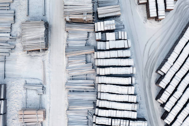 Industry products in winter Top down view of logs and crates in an industrial area in winter. lumber industry timber lumberyard industry stock pictures, royalty-free photos & images