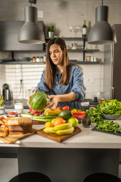 istock Female preparing a healthy lunch 1366655664