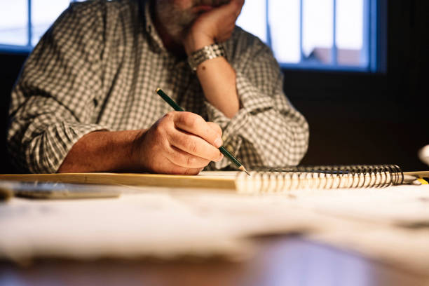 istock Unrecognizable man drawing on a drawing pad. Seniors activities concept. 1366655761