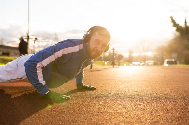istock Happy guy in full strength outdoor exercise 1366655819