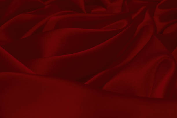 istock Rich and luxury red silk fabric texture background. 1366660540