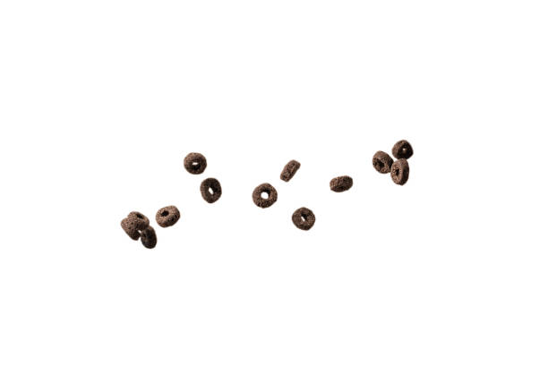 istock Chocolate rings cereal spill out into a bowl. Breakfast. 1366660568