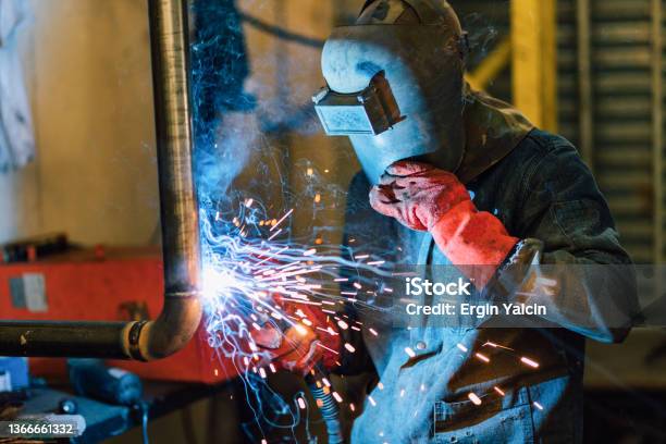 İndustrial Worker Welding On The Pipe Stock Photo - Download Image Now - Welder, Welding, Repairing
