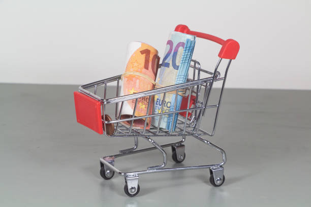 Small shopping cart with banknotes of ten and twenty euros