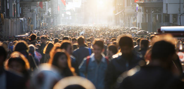 istock Blurred crowd of unrecognizable at the street 1366665458