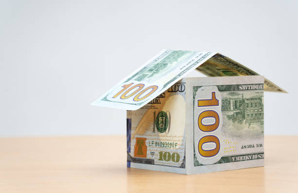 istock House made from one hundred dollar bills on white 1366665824