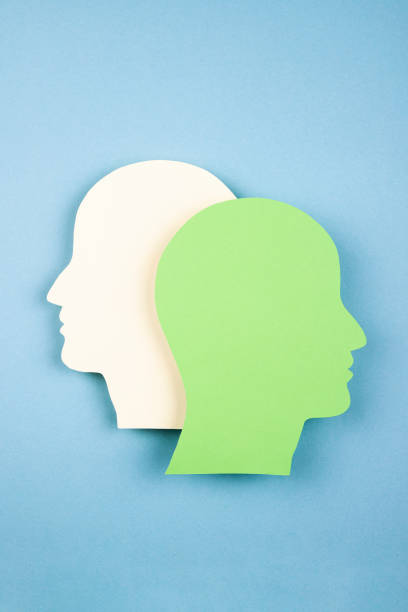 istock Human heads in paper cut style 1366667378