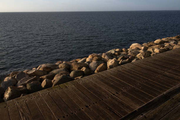 Ocean baordwalk by pier with beautiful water and sky