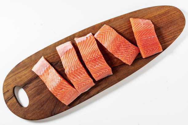 istock slice of salmon on a wooden cutting board 1366671221