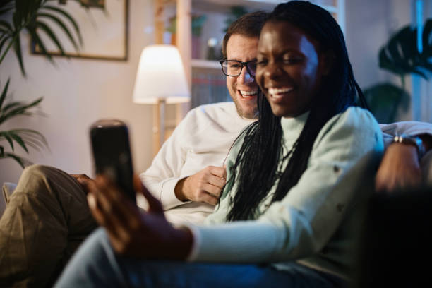 istock Young couple on a video call late at night 1366672979