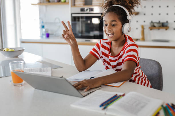 istock Young African American girl learning and talking on a video call 1366673616