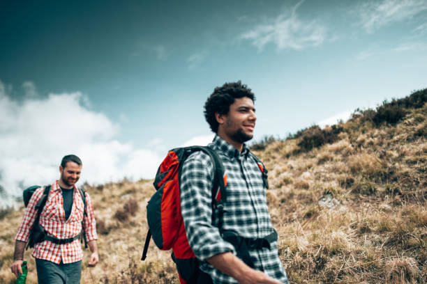 istock friends hiking in the mountains 1366673684