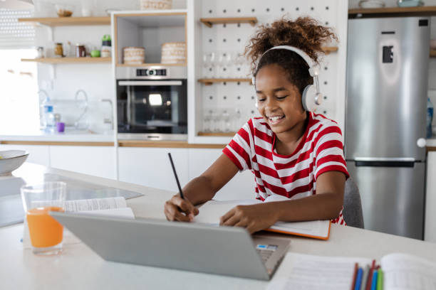 istock Schoolgirl learning and doing her homework for school at home 1366673689