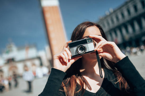 istock tourist in venice in st. mark square 1366673787