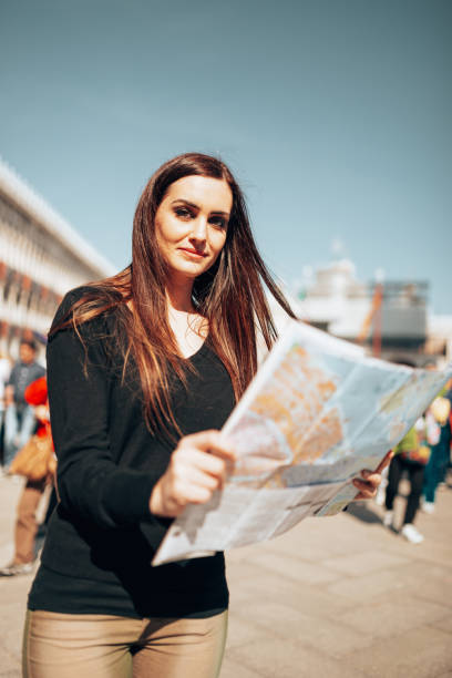 istock tourist in venice in st. mark square reading a map 1366673808