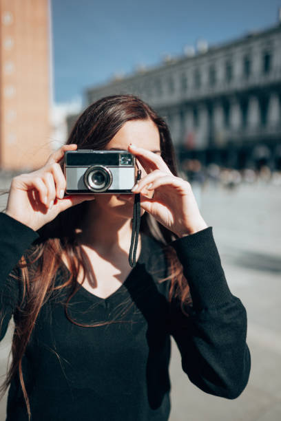 istock tourist in venice in st. mark square 1366674014