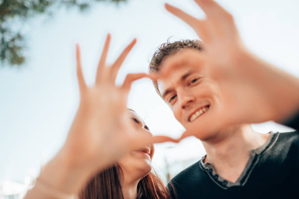 istock tourist creating an heart shape together 1366674044