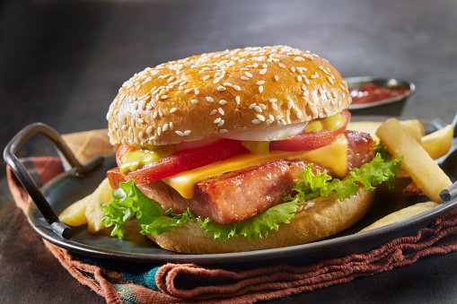 Grilled Spam Burger with Lettuce, Tomato, Onions, Sliced Cheese, Mustard and Fries
