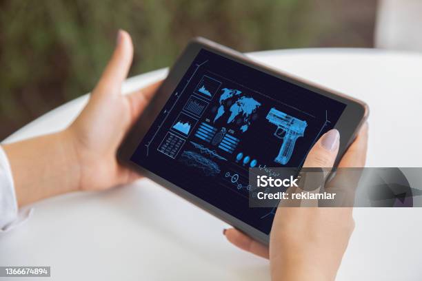 The Image Of The Crime Moments Such As The Location Of The Gun Smuggling Criminal On The Tablet Stock Photo - Download Image Now