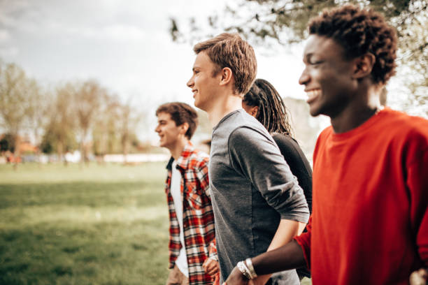 istock multiracial friends embracing together 1366675029