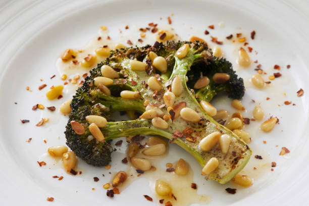 Roasted Broccoli Steak with Olive Oil, Pine Pins and Chili Flakes