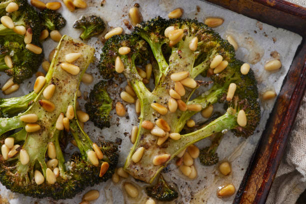 istock Roasted Broccoli Steak with Olive Oil and Pine Pins 1366675235