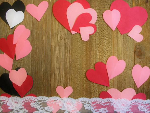 istock paper hearts on rustic wood background 1366677146